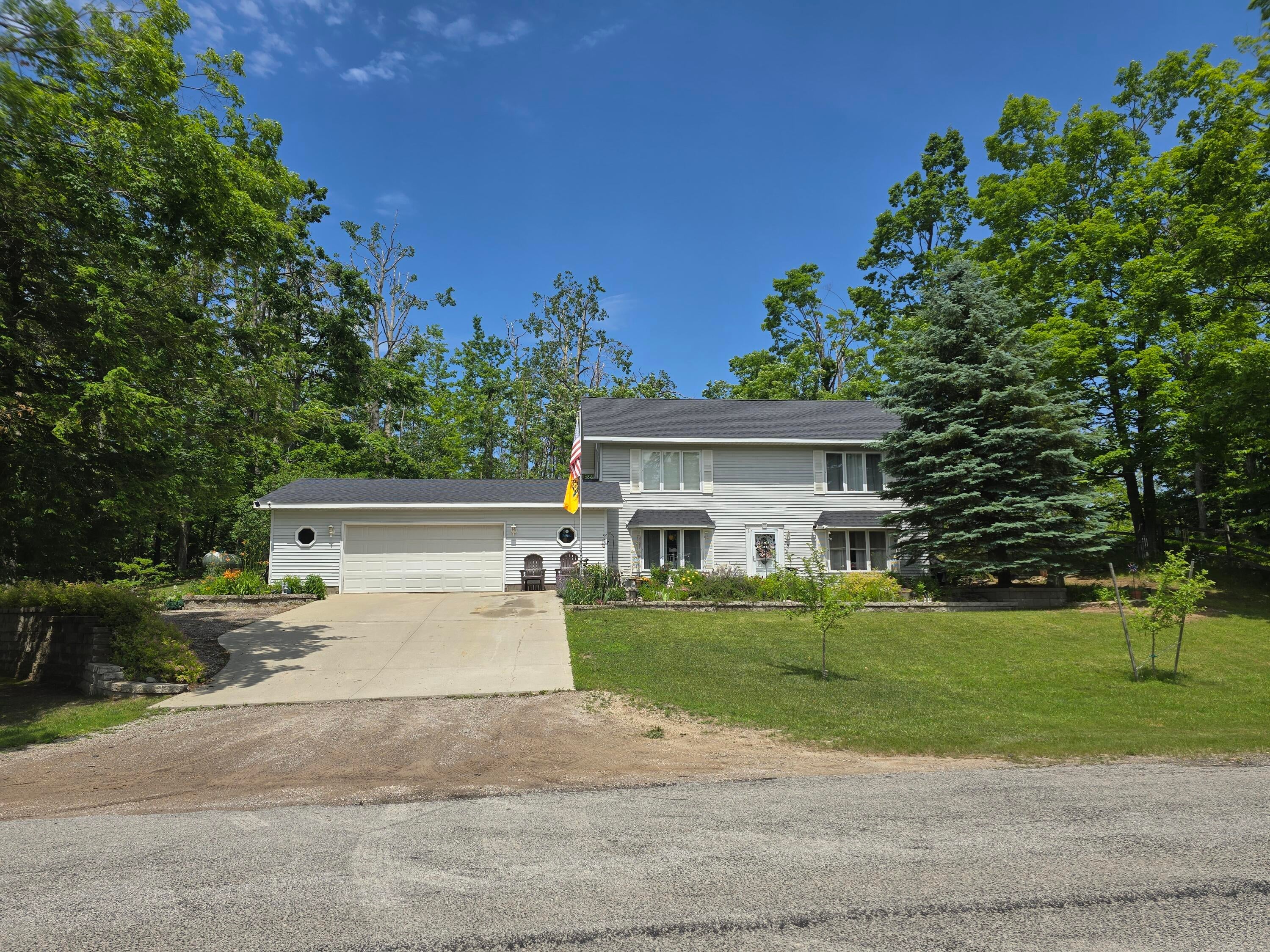 5500 Oley Lake Road Gaylord, MI 49735 - Photo 1 of 44 Front view summer 2025