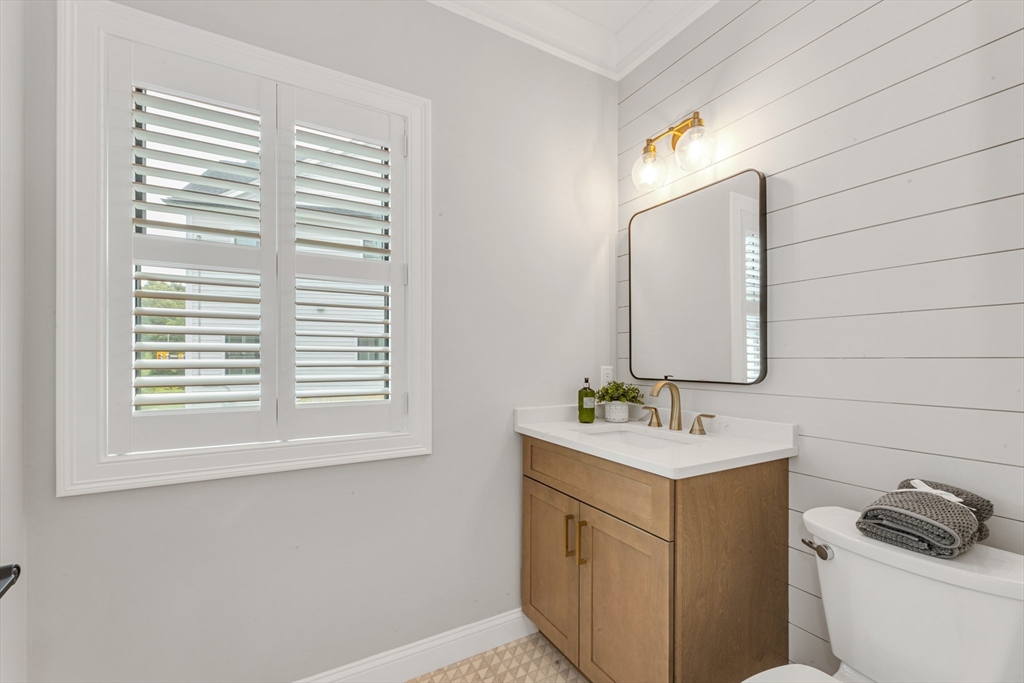 2 Brownson Terrace Boston, MA 02130 - Photo 11 of 30 a bathroom with a sink vanity granite toilet and a mirror