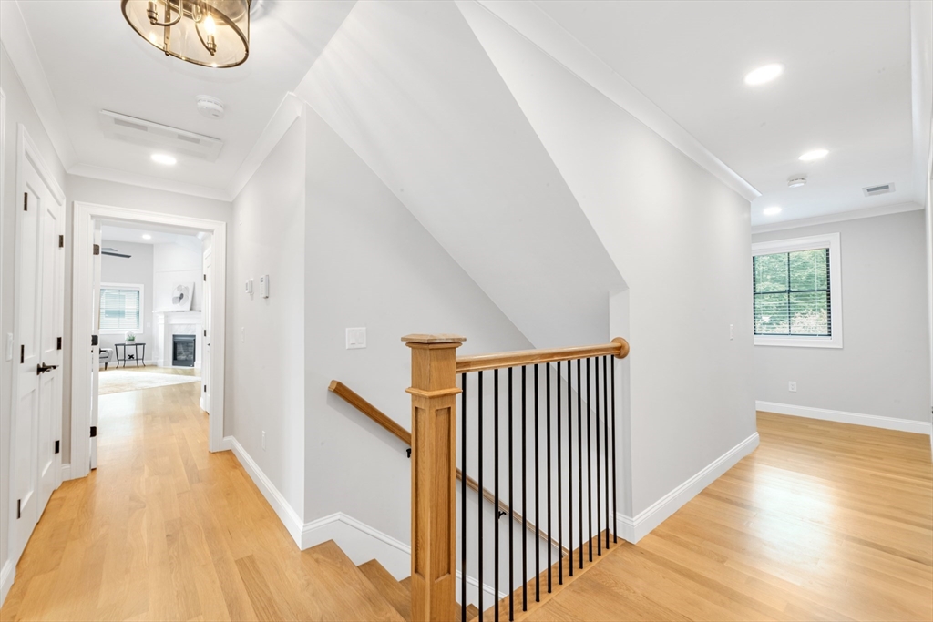 2 Brownson Terrace Boston, MA 02130 - Photo 12 of 30 a view of a hallway with wooden floor and staircase