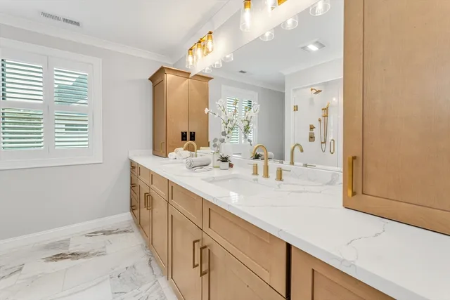 a spacious bathroom with a sink a mirror and a shower