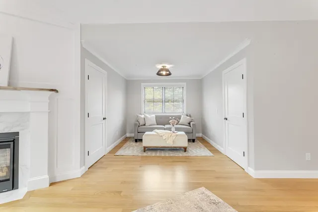 a spacious bedroom with a bed and window