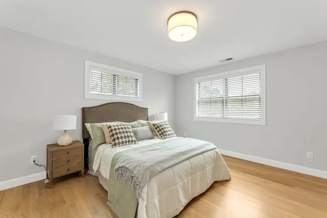 a bedroom with bed and window