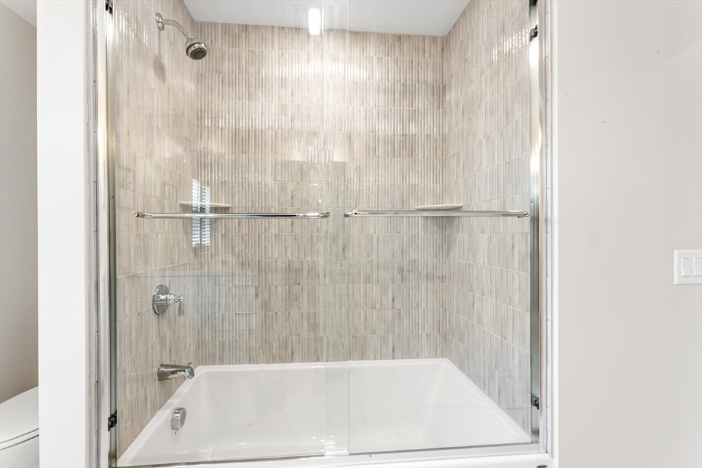 2 Brownson Terrace Boston, MA 02130 - Photo 21 of 30 a bathroom with a bathtub and shower