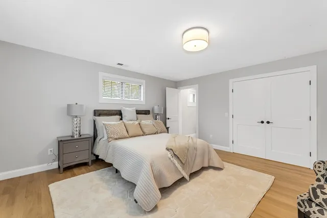 a bedroom with a bed and a night lamp