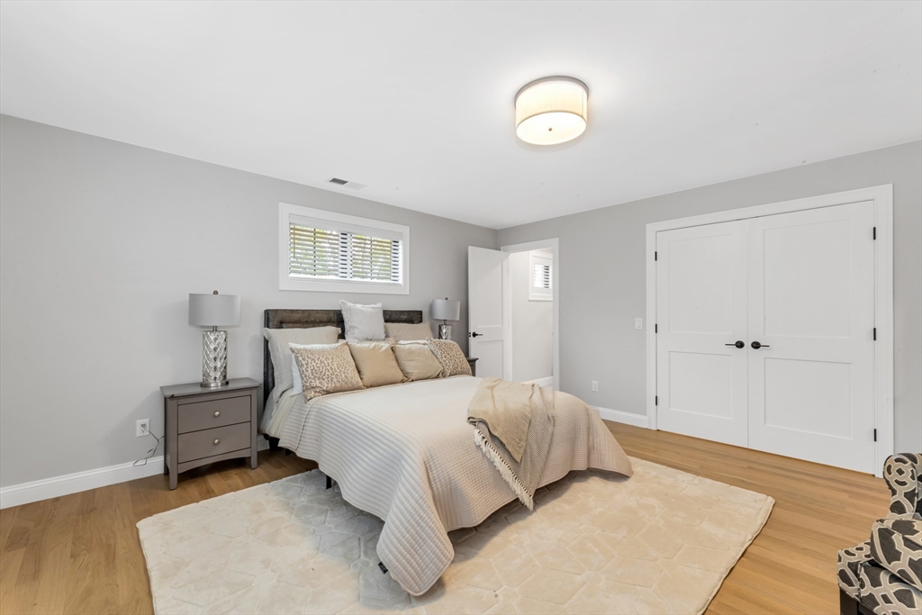 2 Brownson Terrace Boston, MA 02130 - Photo 22 of 30 a bedroom with a bed and a night lamp