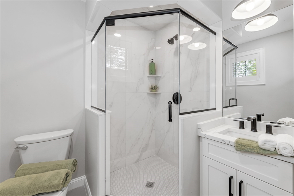 2 Brownson Terrace Boston, MA 02130 - Photo 23 of 30 a bathroom with a sink a toilet and a mirror