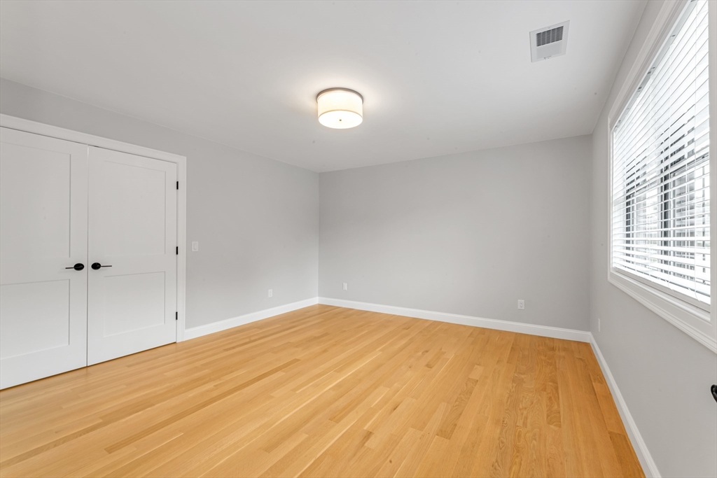 2 Brownson Terrace Boston, MA 02130 - Photo 24 of 30 wooden floor in an empty room with a window