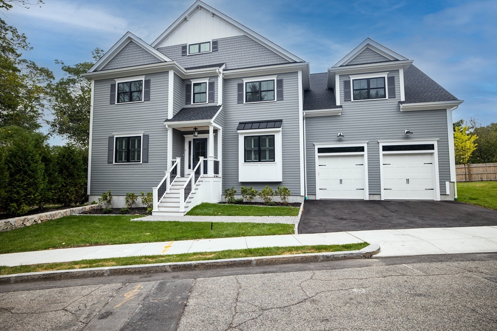 2 Brownson Terrace Boston, MA 02130 - Photo 25 of 30 a front view of a house with a yard and garage