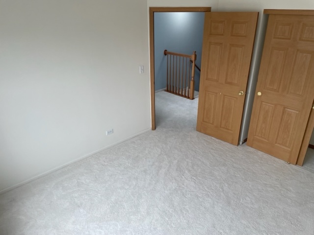 2439 Oneida Lane Naperville, IL 60563 - Photo 14 of 15 a view of a hallway with wooden floor