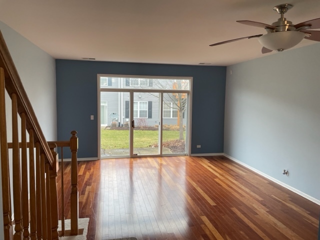 2439 Oneida Lane Naperville, IL 60563 - Photo 6 of 15 a view of an empty room with glass door