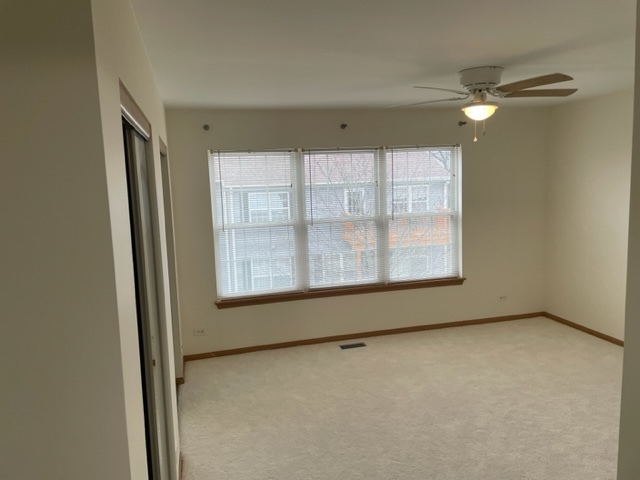 2439 Oneida Lane Naperville, IL 60563 - Photo 9 of 15 a view of an empty room with a window