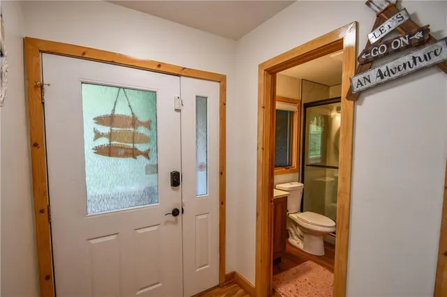 a kitchen with stainless steel appliances granite countertop a refrigerator and a stove