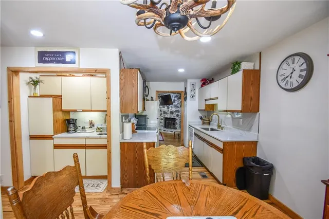 a living room with furniture fireplace and a large window