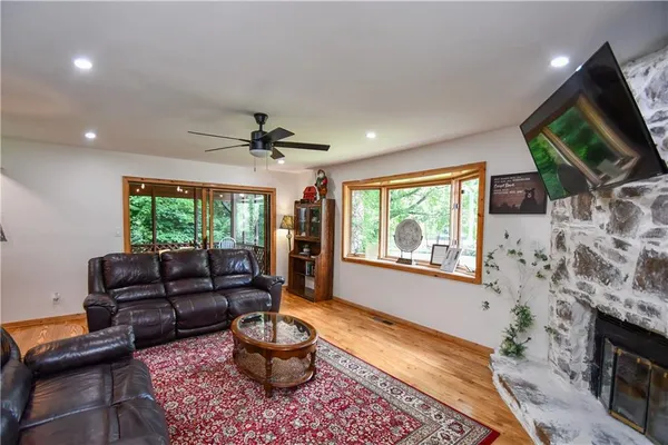 a view of a city from a dining room with furniture window and wooden floor