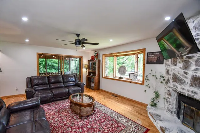 a view of a city from a dining room with furniture window and wooden floor