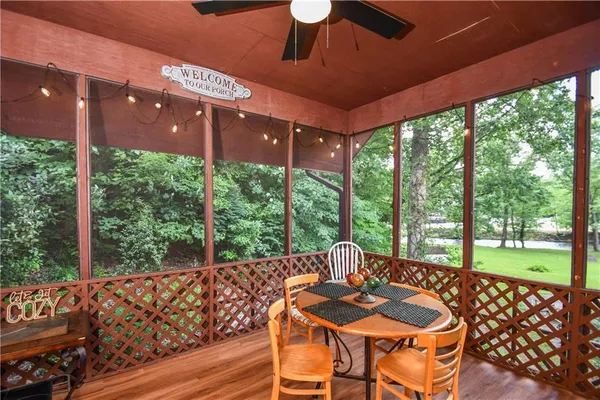 a bedroom with bed and wooden floor