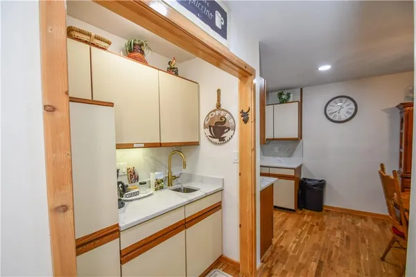 a dining room with furniture a chandelier and window