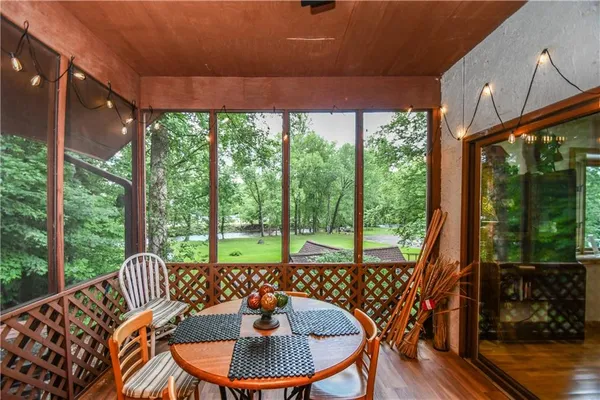 a living room with furniture and a ceiling fan
