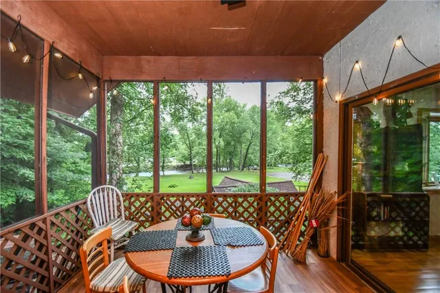 a living room with furniture and a ceiling fan