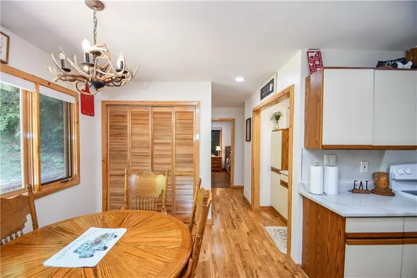 a kitchen with stainless steel appliances granite countertop sink stove and cabinets