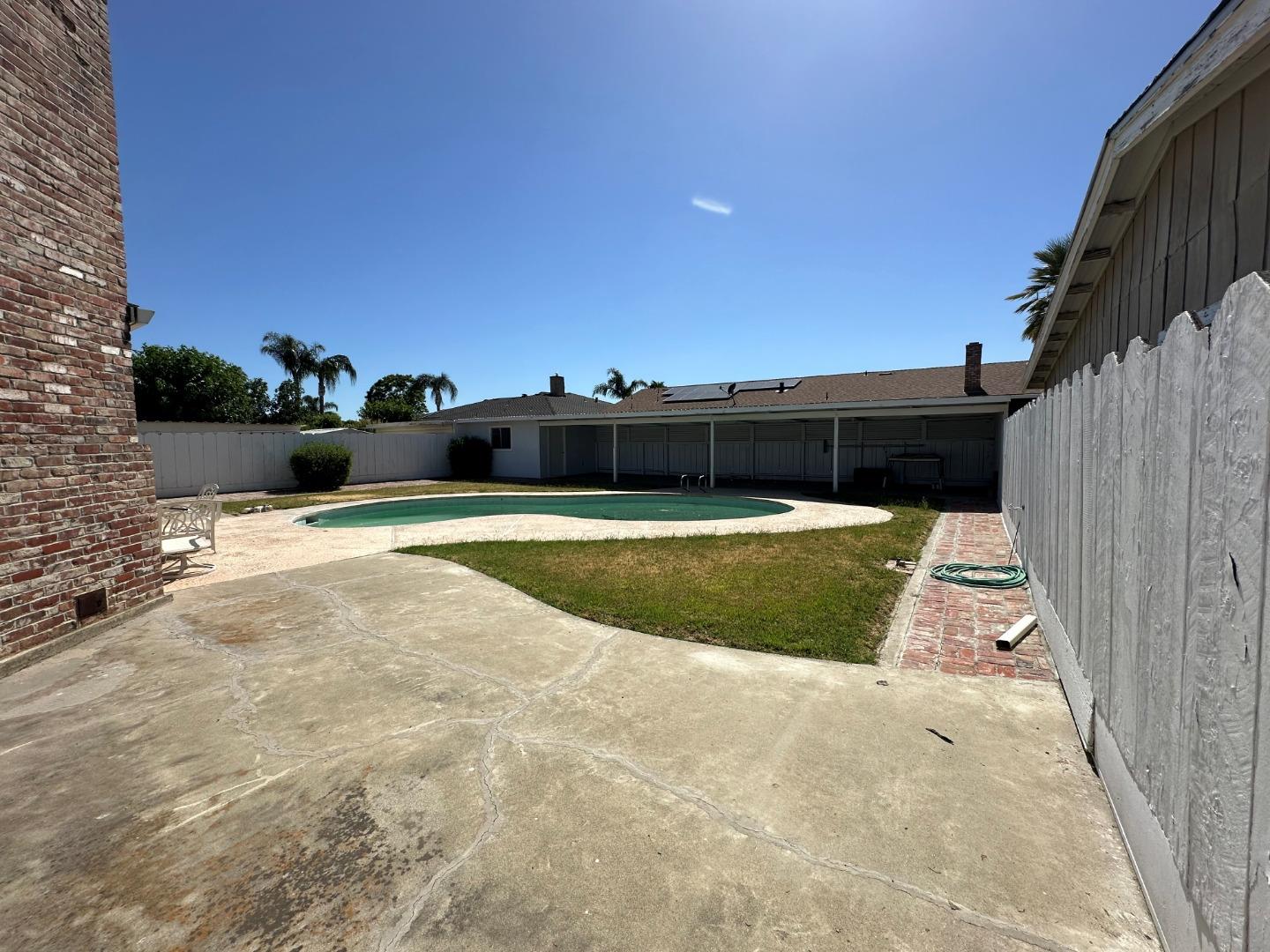 985 Grove Avenue Gustine, CA 95322 - Photo 14 of 14 a view of swimming pool with a yard