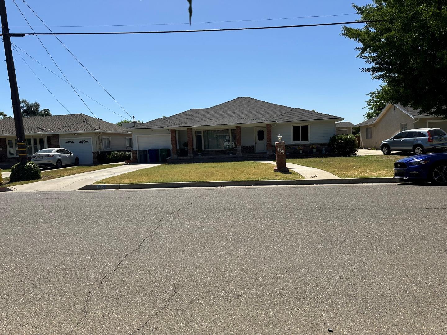 985 Grove Avenue Gustine, CA 95322 - Photo 2 of 14 a view of street with parked cars
