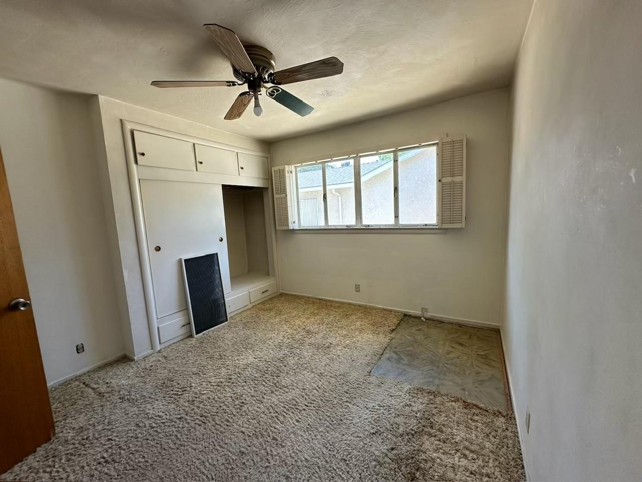 985 Grove Avenue Gustine, CA 95322 - Photo 7 of 14 a view of a livingroom with a ceiling fan and window
