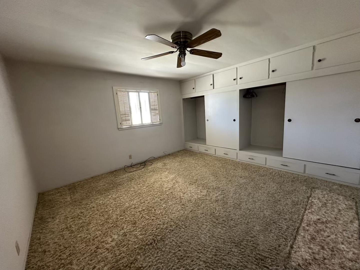 985 Grove Avenue Gustine, CA 95322 - Photo 9 of 14 a view of empty room with ceiling fan