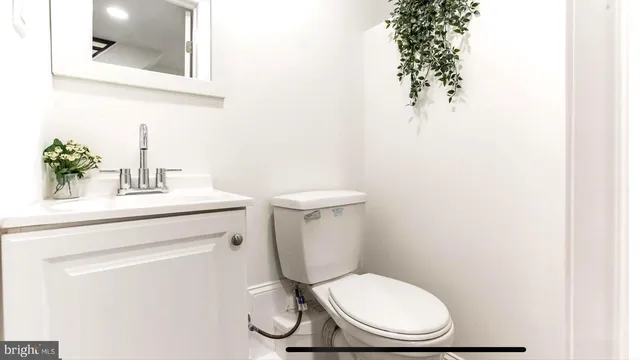 a bathroom with a toilet and a sink