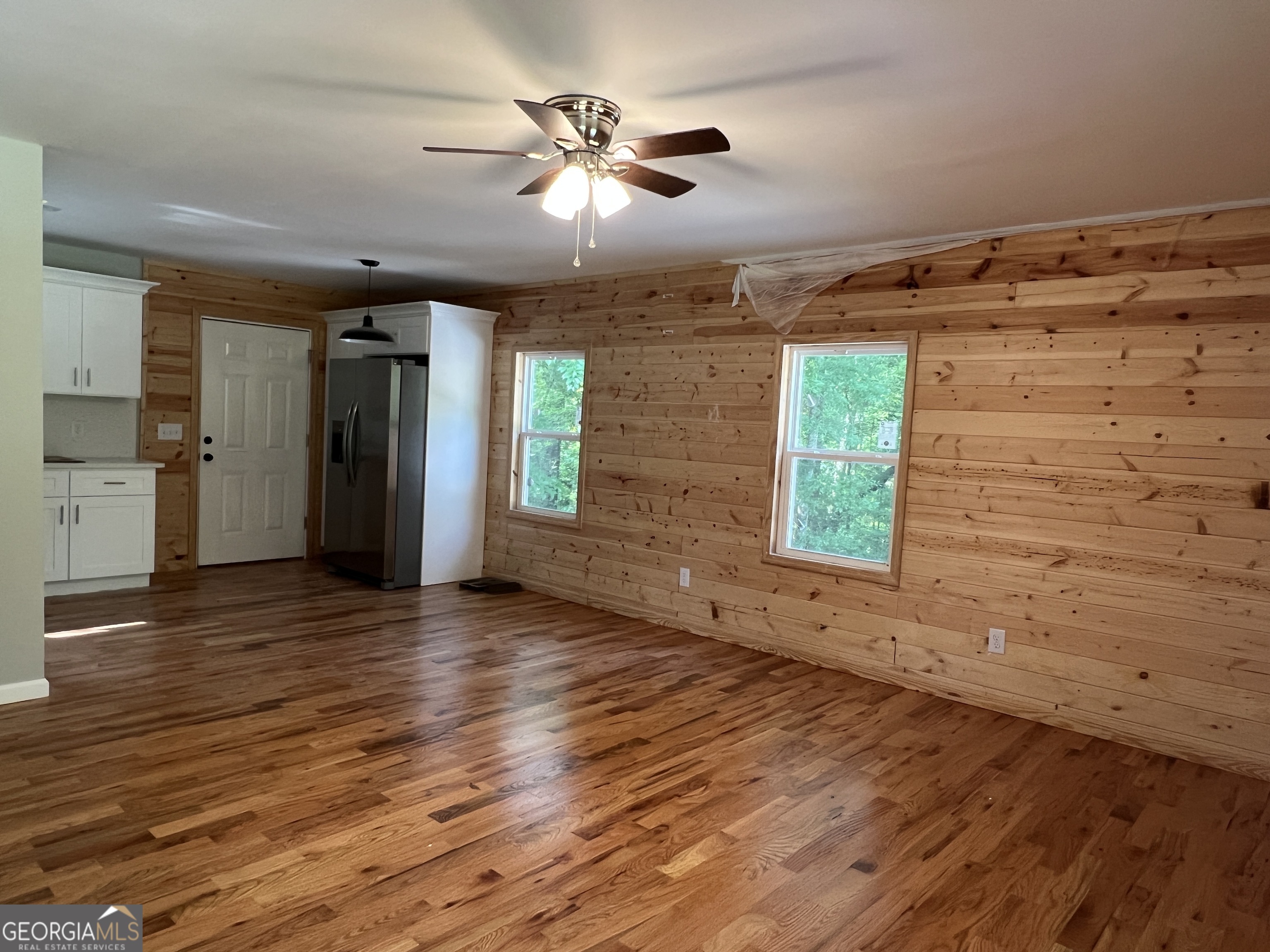 984 Plowshare Road Carrollton, GA 30117 - Photo 4 of 15 wooden floor in an empty room with a window