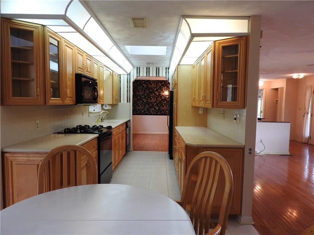 110 Rays Road Fenelton, PA 16034 - Photo 15 of 25 Updated kitchen with ceramic tile back splash, ceramic tile floors and breakfast area.