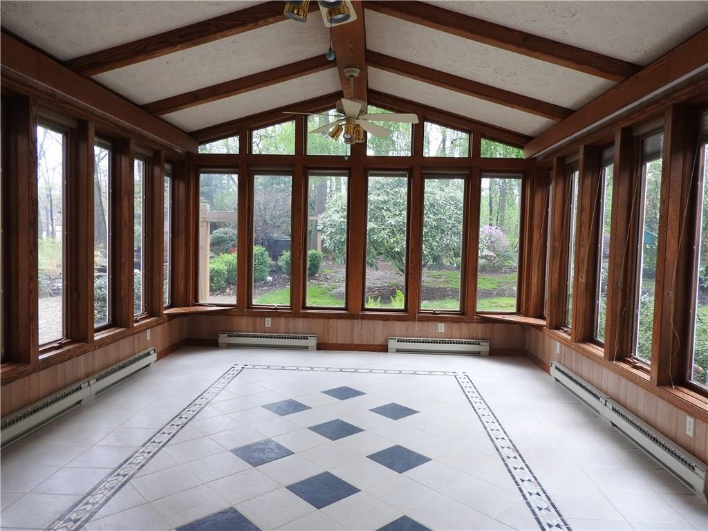 110 Rays Road Fenelton, PA 16034 - Photo 17 of 25 Wall to Ceiling windows in this beautiful sun room with base board heat. This home boasts of serene breathtaking views of the back yard.