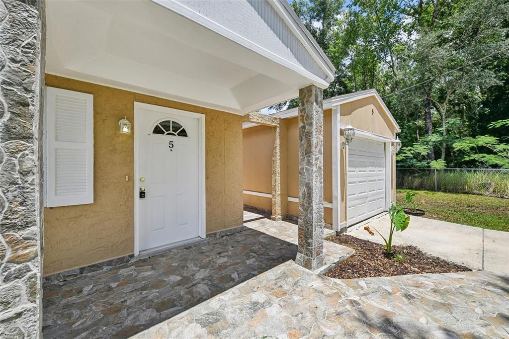 5 Cedar Lane Ocala, FL 34472 - Photo 3 of 23 a view of a house with backyard