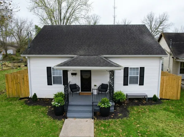 a front view of a house with garden