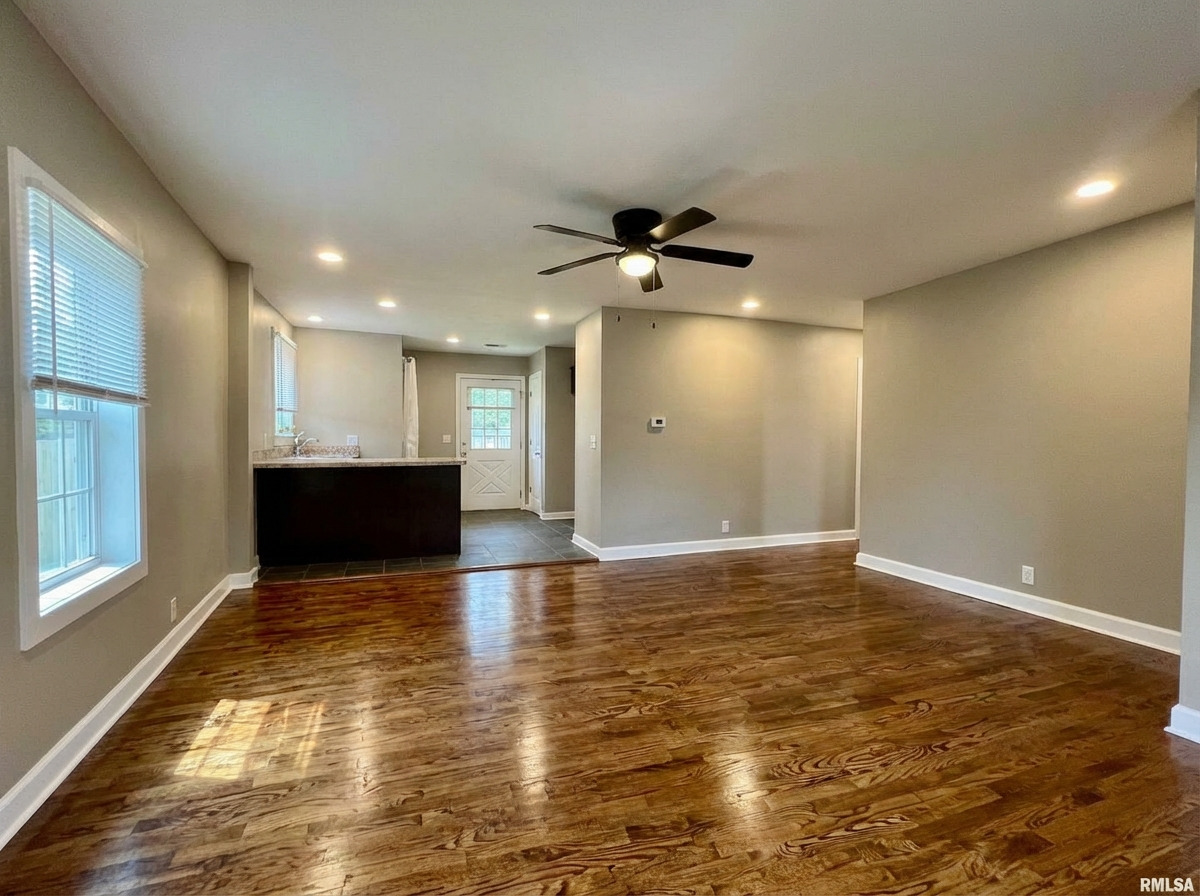 314 West 12th Street Metropolis, IL 62960 - Photo 13 of 29 a view of an empty room with window and wooden floor
