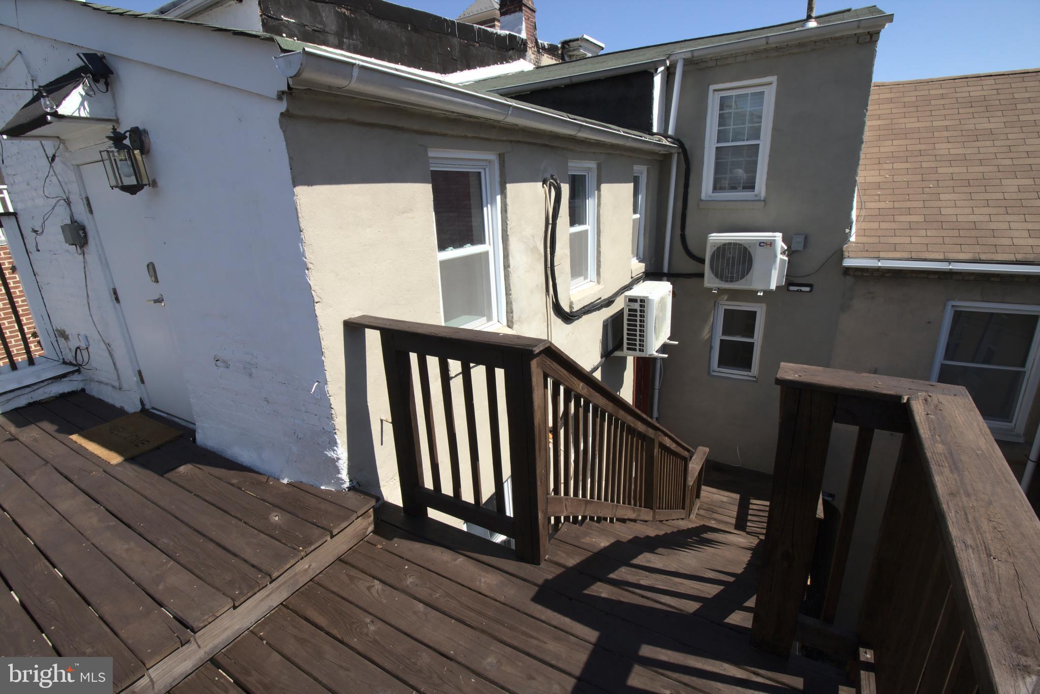 244 South Exeter Street, Unit 3 Baltimore, MD 21202 - Photo 14 of 18 a view of balcony and wooden floor