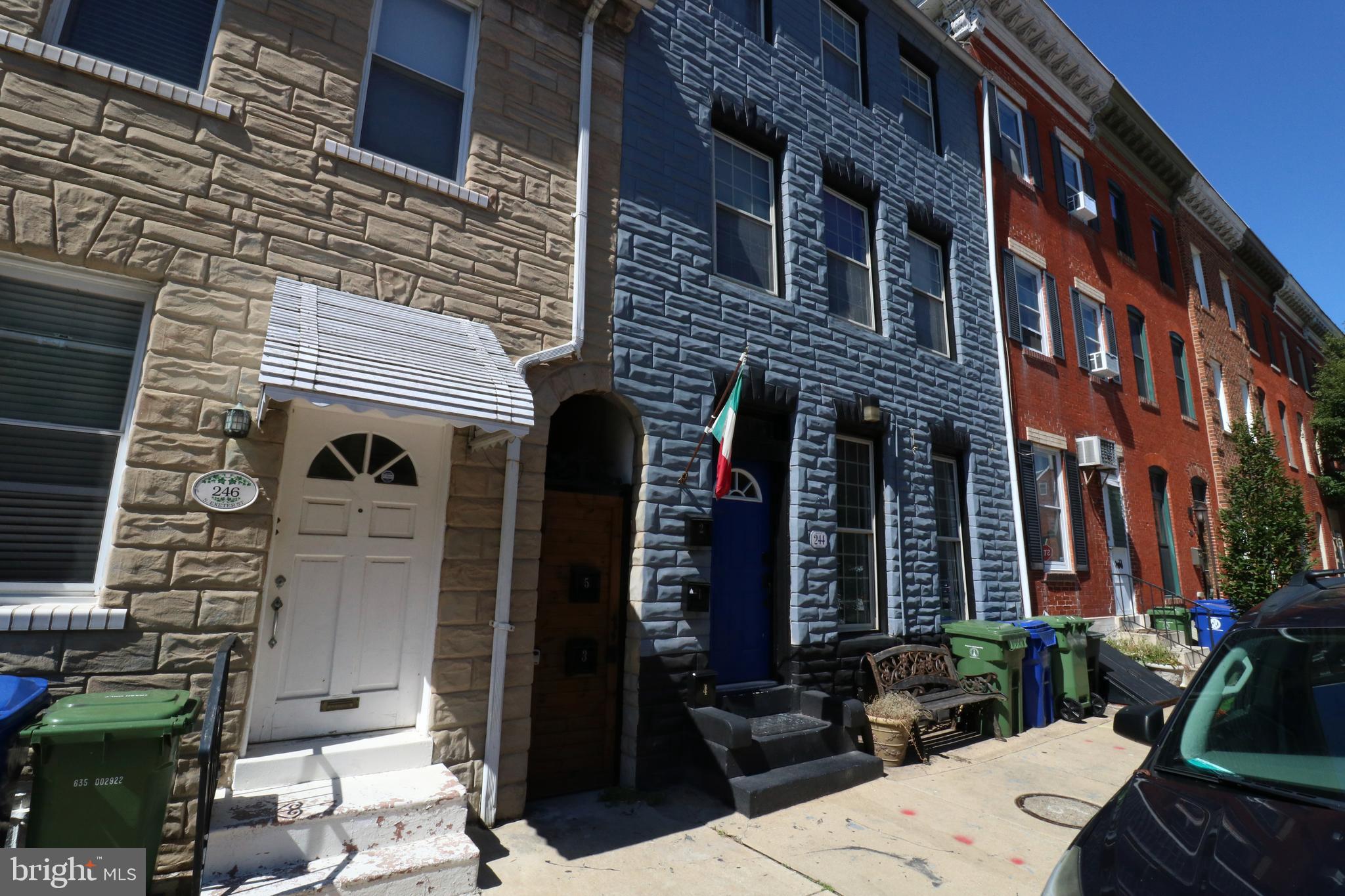 244 South Exeter Street, Unit 3 Baltimore, MD 21202 - Photo 16 of 18 a view of a brick building with many windows