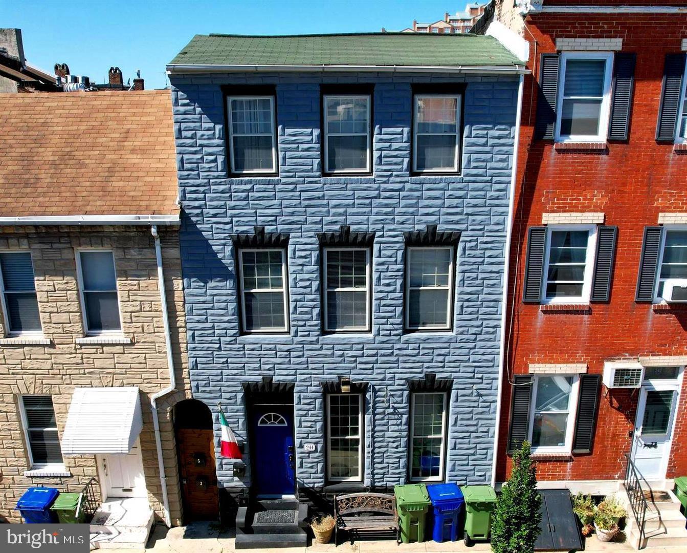 244 South Exeter Street, Unit 3 Baltimore, MD 21202 - Photo 17 of 18 a front view of a house with many windows