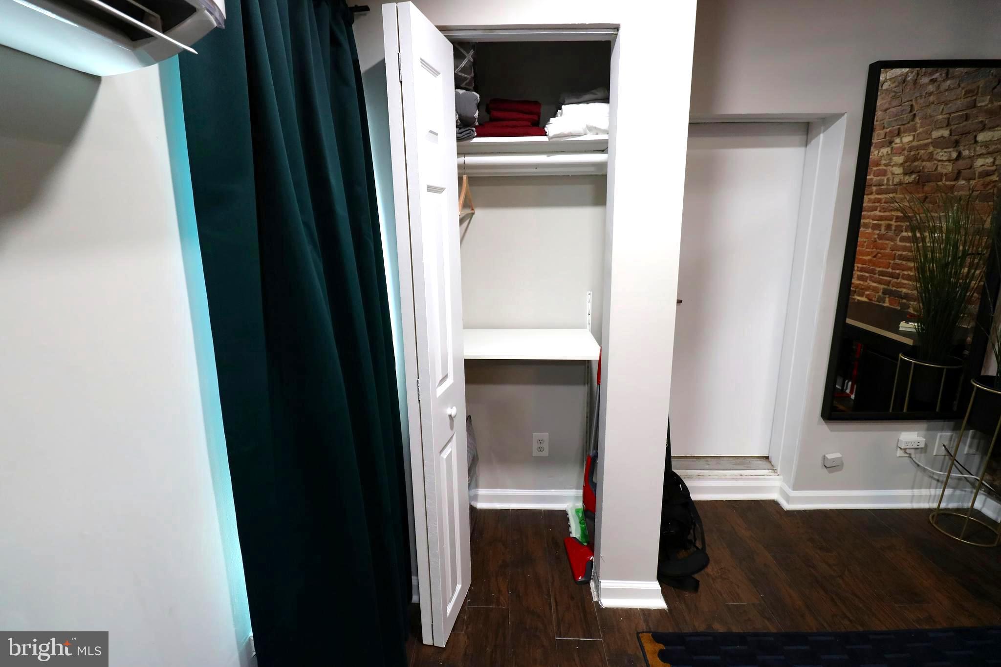 244 South Exeter Street, Unit 3 Baltimore, MD 21202 - Photo 10 of 18 a view of walk in closet with clothes and shoes
