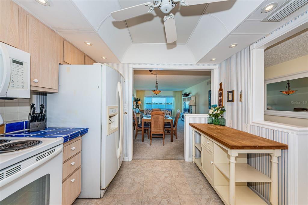 4750 Cove Circle, Unit 303 St. Petersburg, FL 33708 - Photo 12 of 64 a kitchen with a refrigerator and a stove