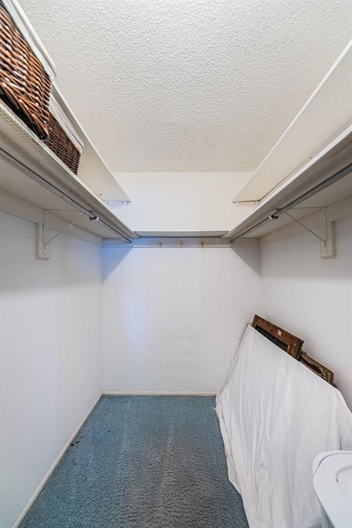 4750 Cove Circle, Unit 303 St. Petersburg, FL 33708 - Photo 25 of 64 a view of a room with racks on the wall