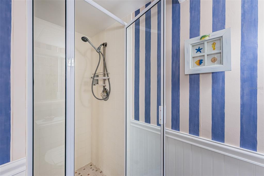 4750 Cove Circle, Unit 303 St. Petersburg, FL 33708 - Photo 32 of 64 a bathroom with a shower