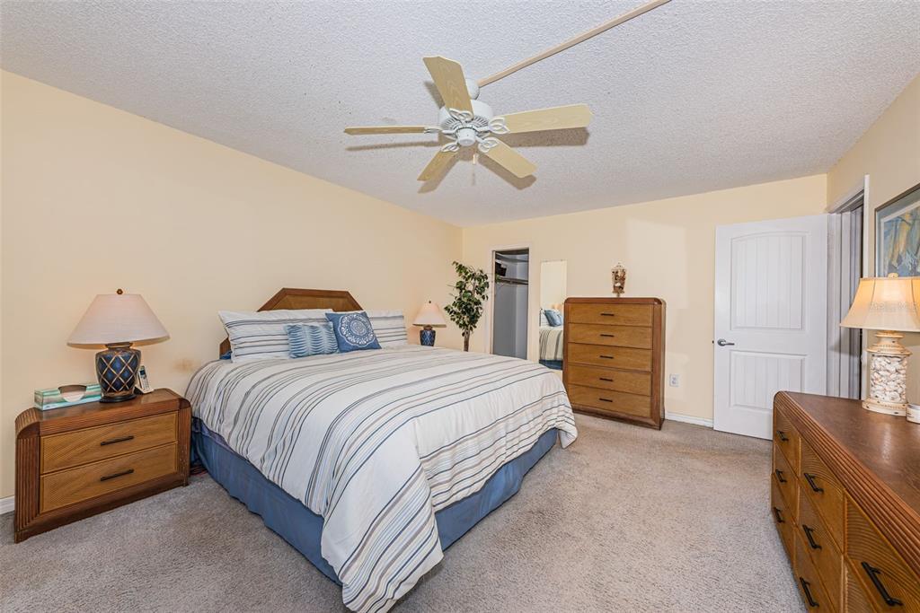 4750 Cove Circle, Unit 303 St. Petersburg, FL 33708 - Photo 5 of 64 a bedroom with bed and window