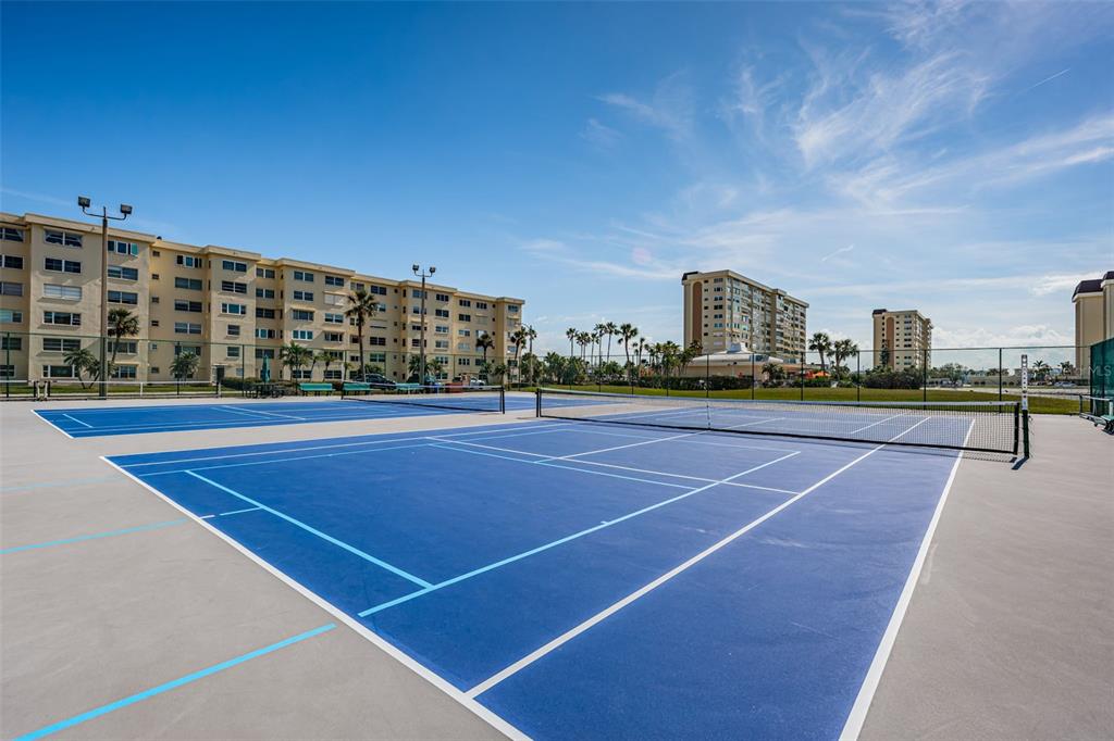 4750 Cove Circle, Unit 303 St. Petersburg, FL 33708 - Photo 63 of 64 a view of a tennis court