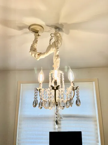 an empty room with wooden floor and cabinet