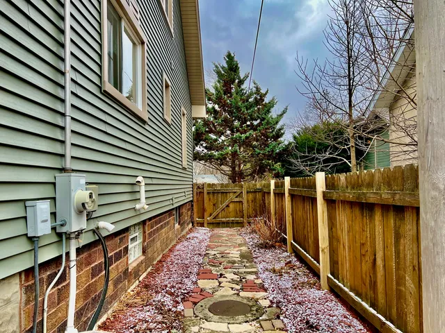 a swimming pool with outdoor seating yard and barbeque oven