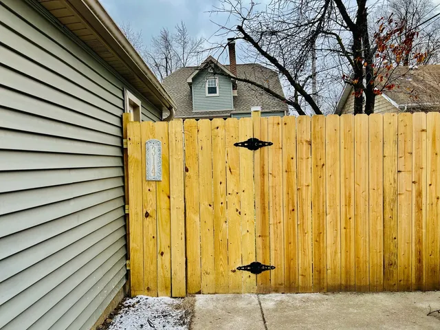 a view of a house with a flower garden