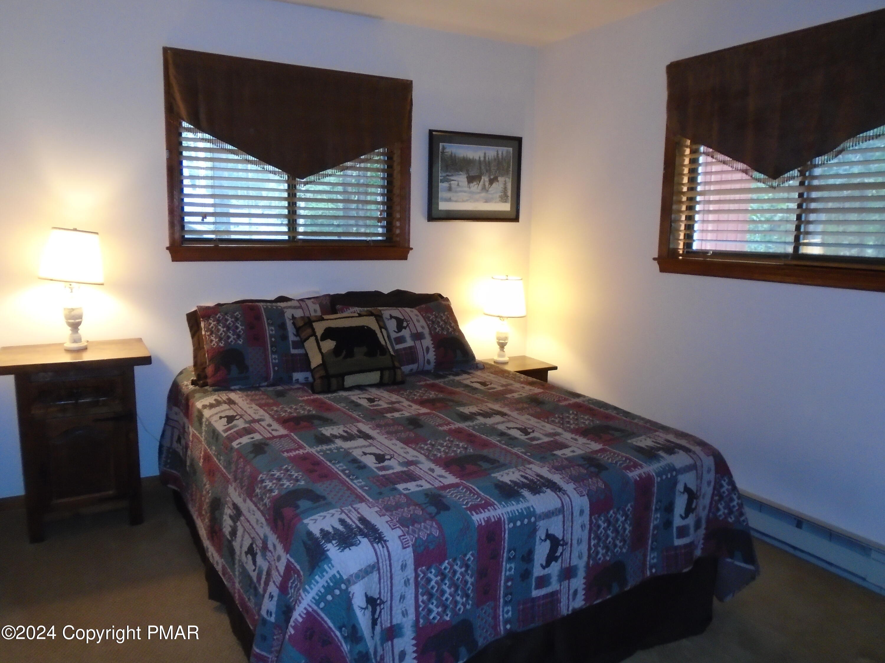 368 Ridge Road Pocono Lake, PA 18347 - Photo 24 of 42 a bedroom with a bed and window