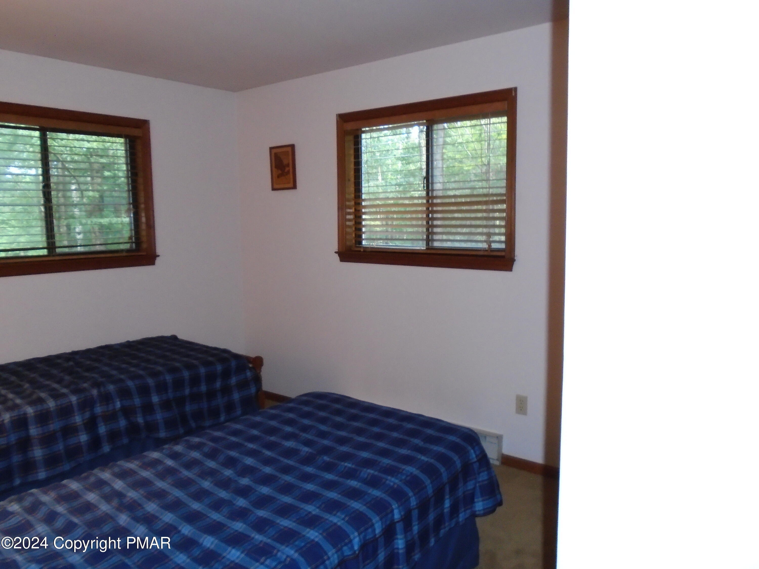 368 Ridge Road Pocono Lake, PA 18347 - Photo 26 of 42 a bedroom with a bed and a window