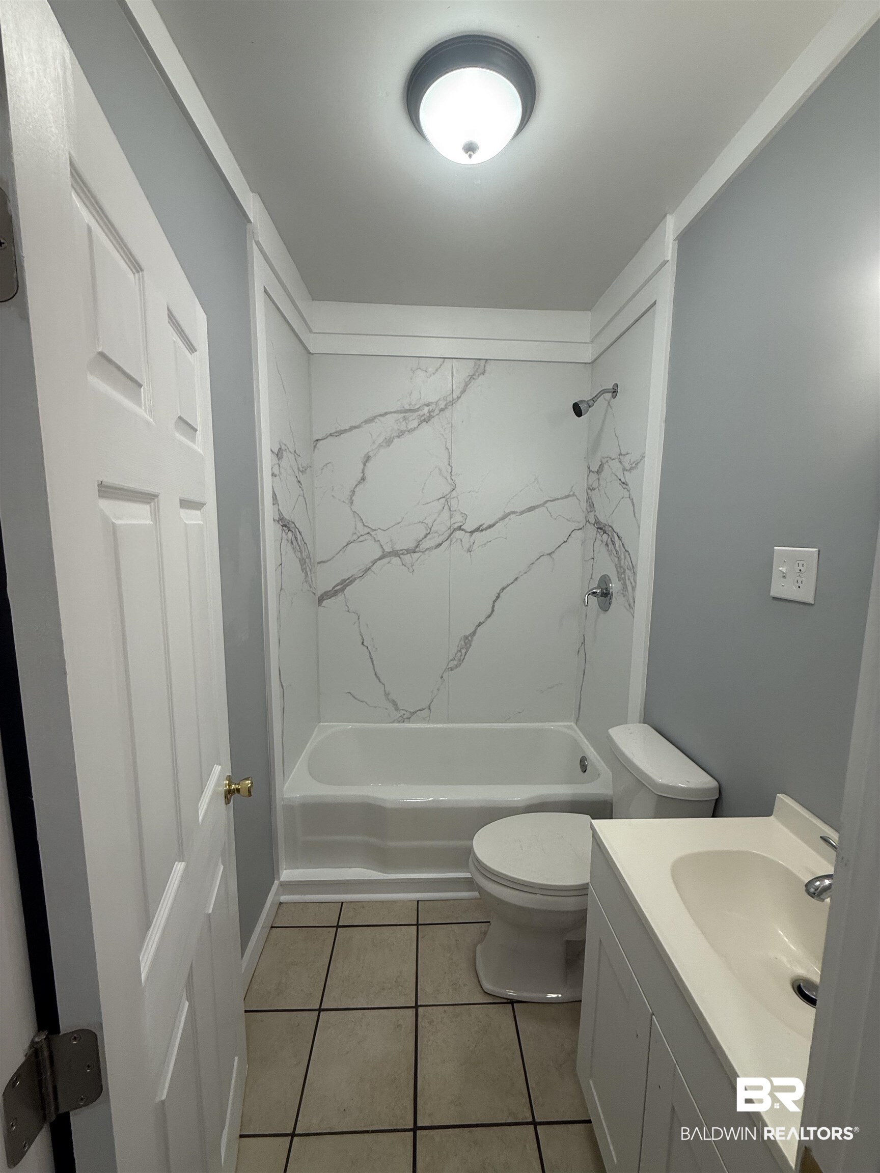17440 Old Brady Road Bay Minette, AL 36507 - Photo 9 of 9 Full bathroom with bathroom sink, tub / shower combination, and light tile patterned flooring